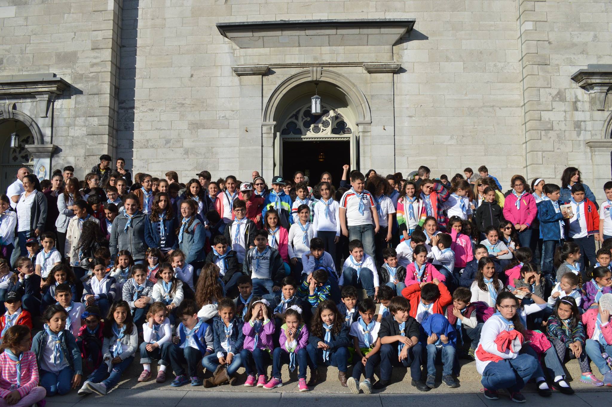 Fersan children gathered on the church steps during a pilgrimage